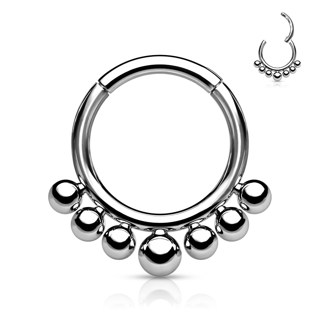 Ring made of titanium with a hinge and small beads