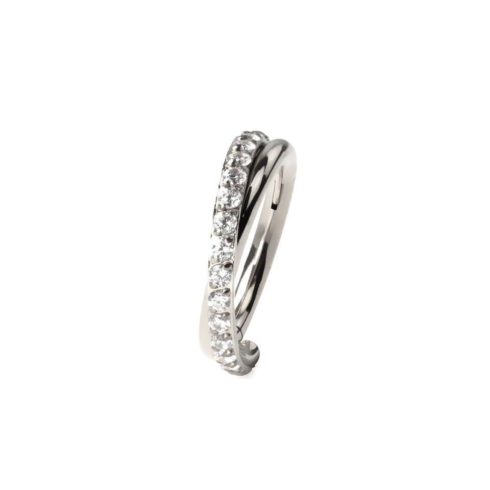 Hinged segment ring with stone-paved crossover arch