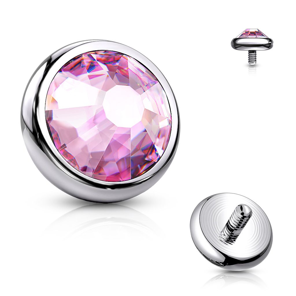 Dermal top jewelry made of titanium with colored stone.