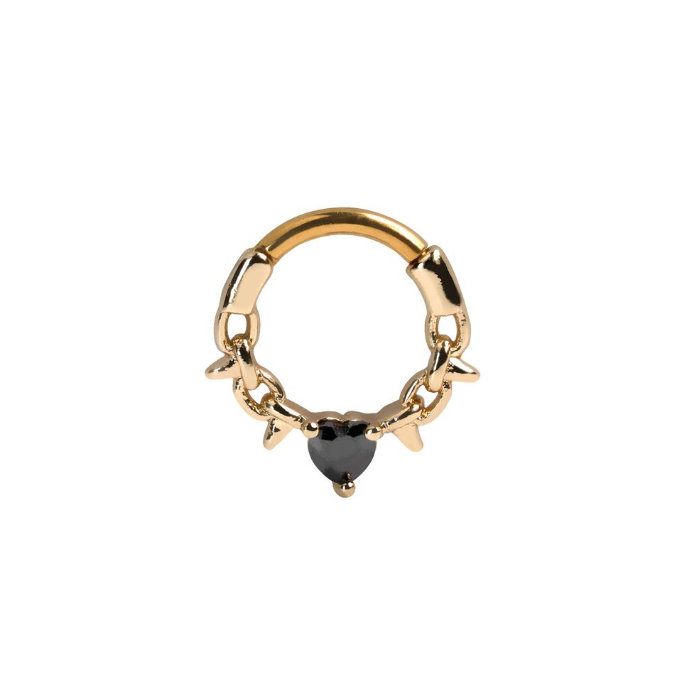 Forward facing ring with barbed wire and heart shaped gem