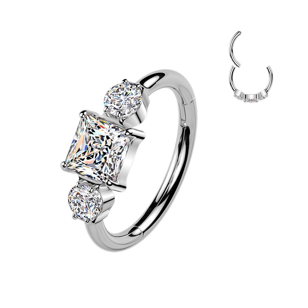 Titanium hinged ring with three CZ stones
