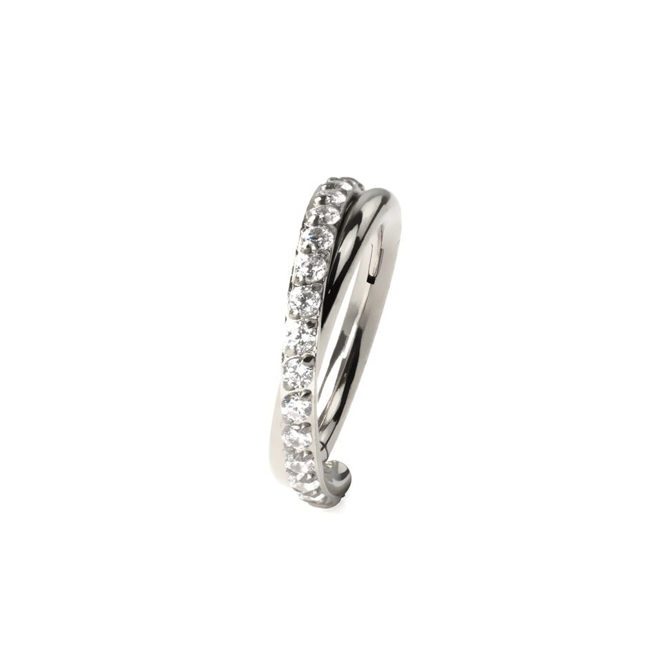 Hinged segment ring with stone-paved crossover arch