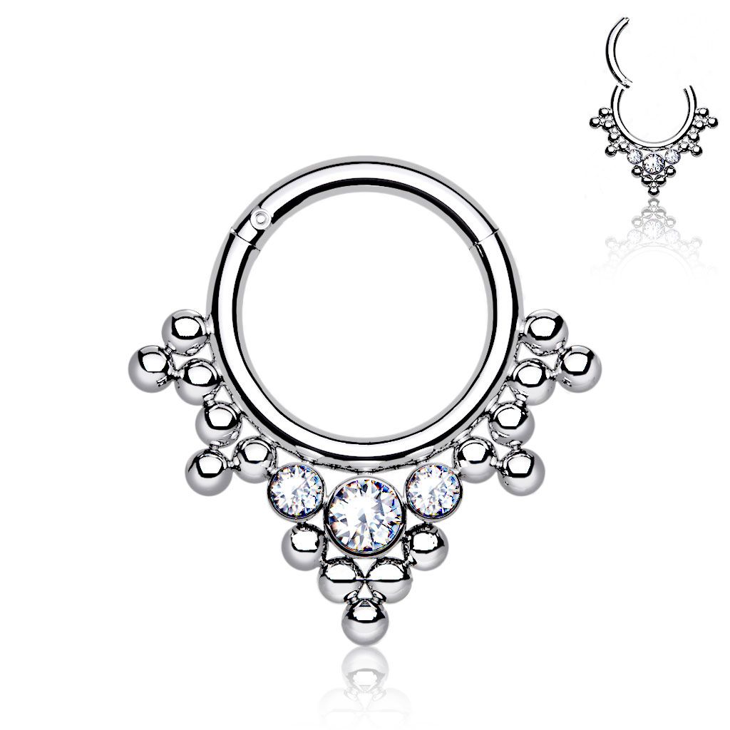 Hinged ring made of titanium with clustered beads and stones