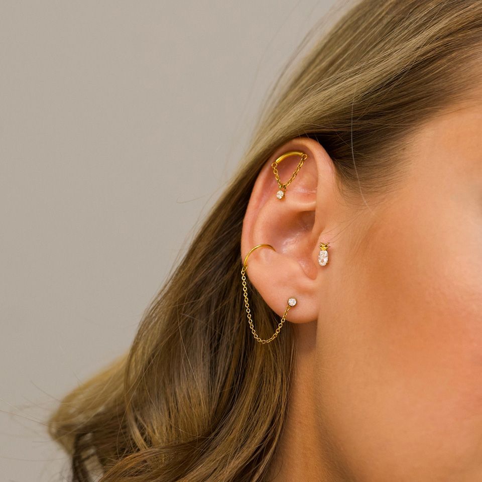 Curved bar labret with chain and stone dangle