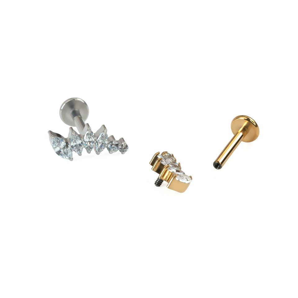 Curved titanium labret with stones in decreasing sizes