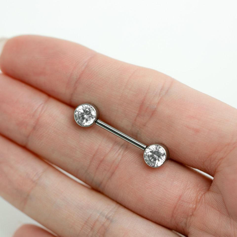 Nipple barbell made of titanium with threadless push-in bezel set stones