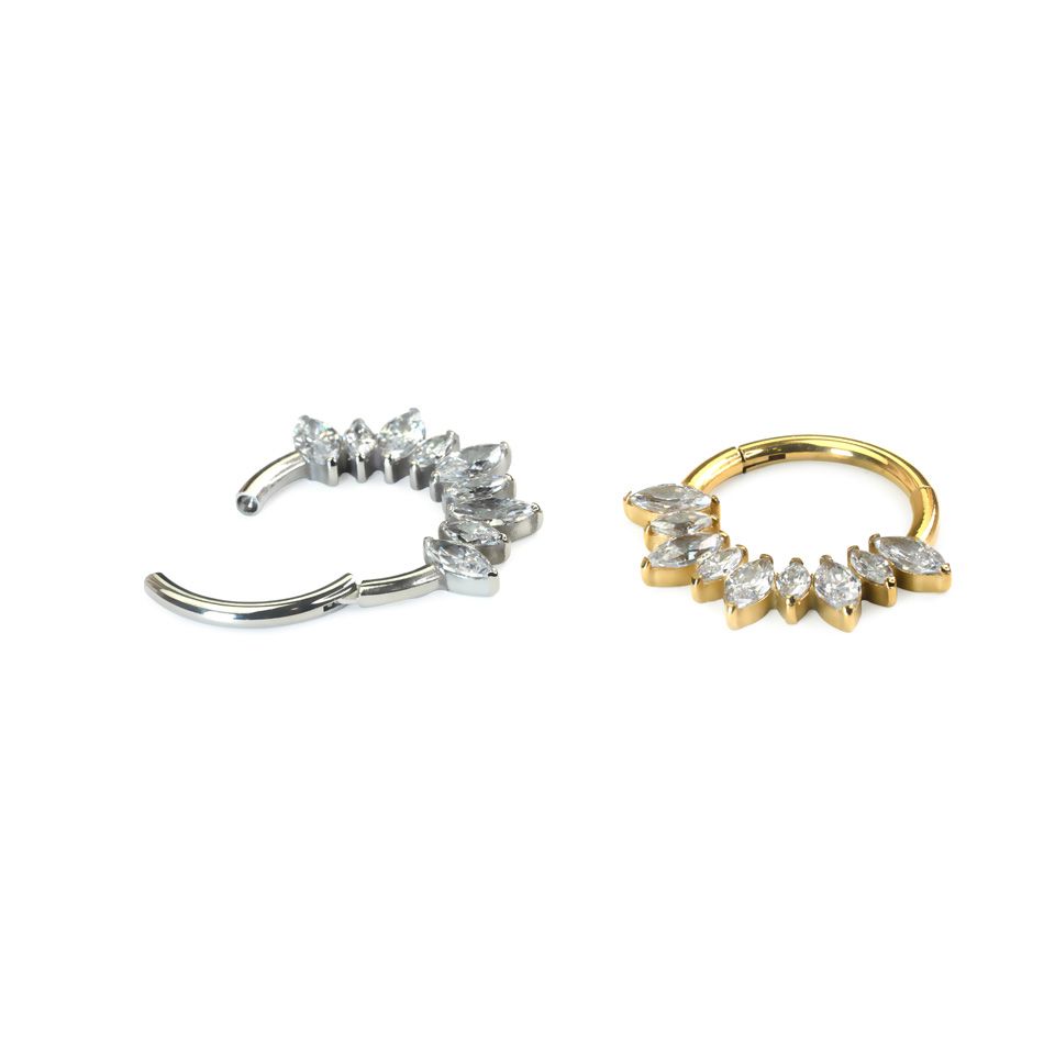 Hinged titanium ring with forward facing marquise stones