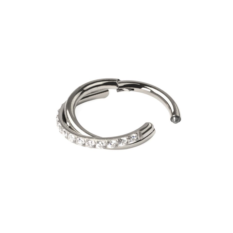 Hinged segment ring with stone-paved crossover arch