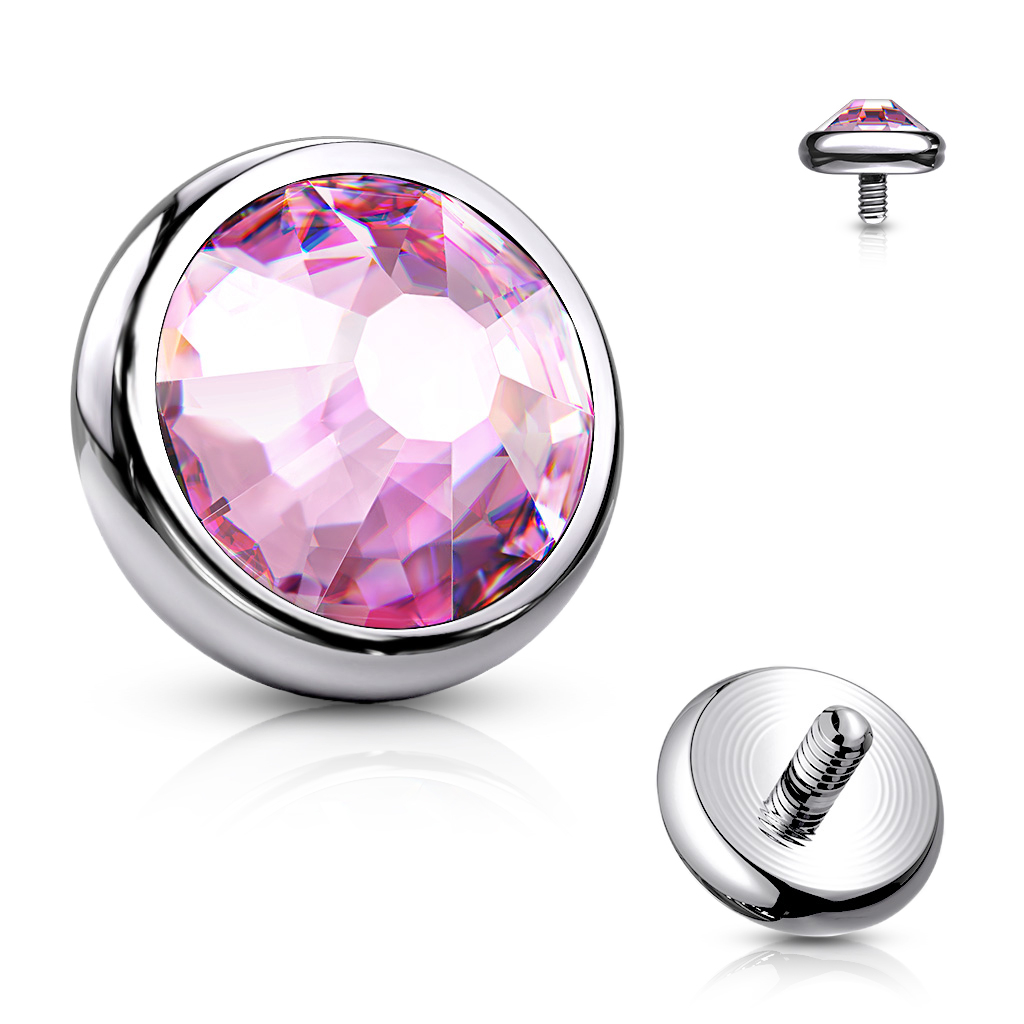 Dermal top jewelry made of titanium with colored stone.
