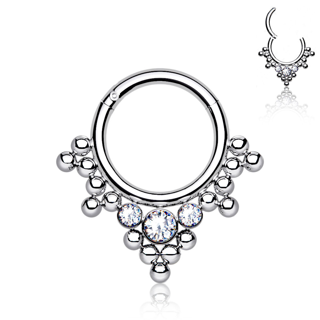 Hinged ring made of titanium with clustered beads and stones