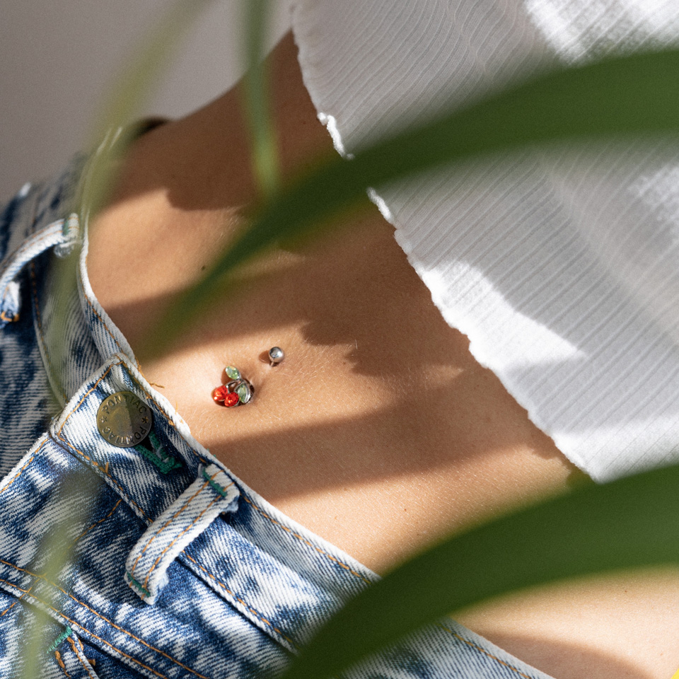 Belly button ring with red cherries