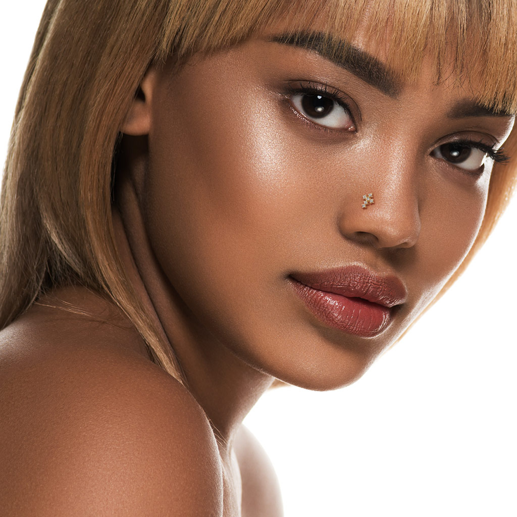 Nose ring made of 14k gold with studded cross