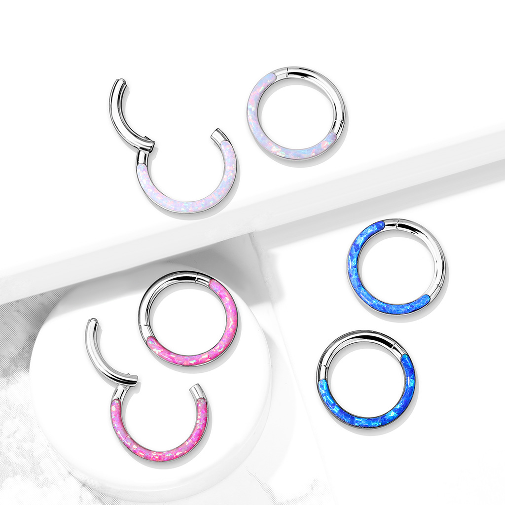 Ring made of titanium with a hinge and opal front